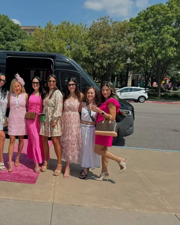 Group of women in front of a black TIED Sprinter