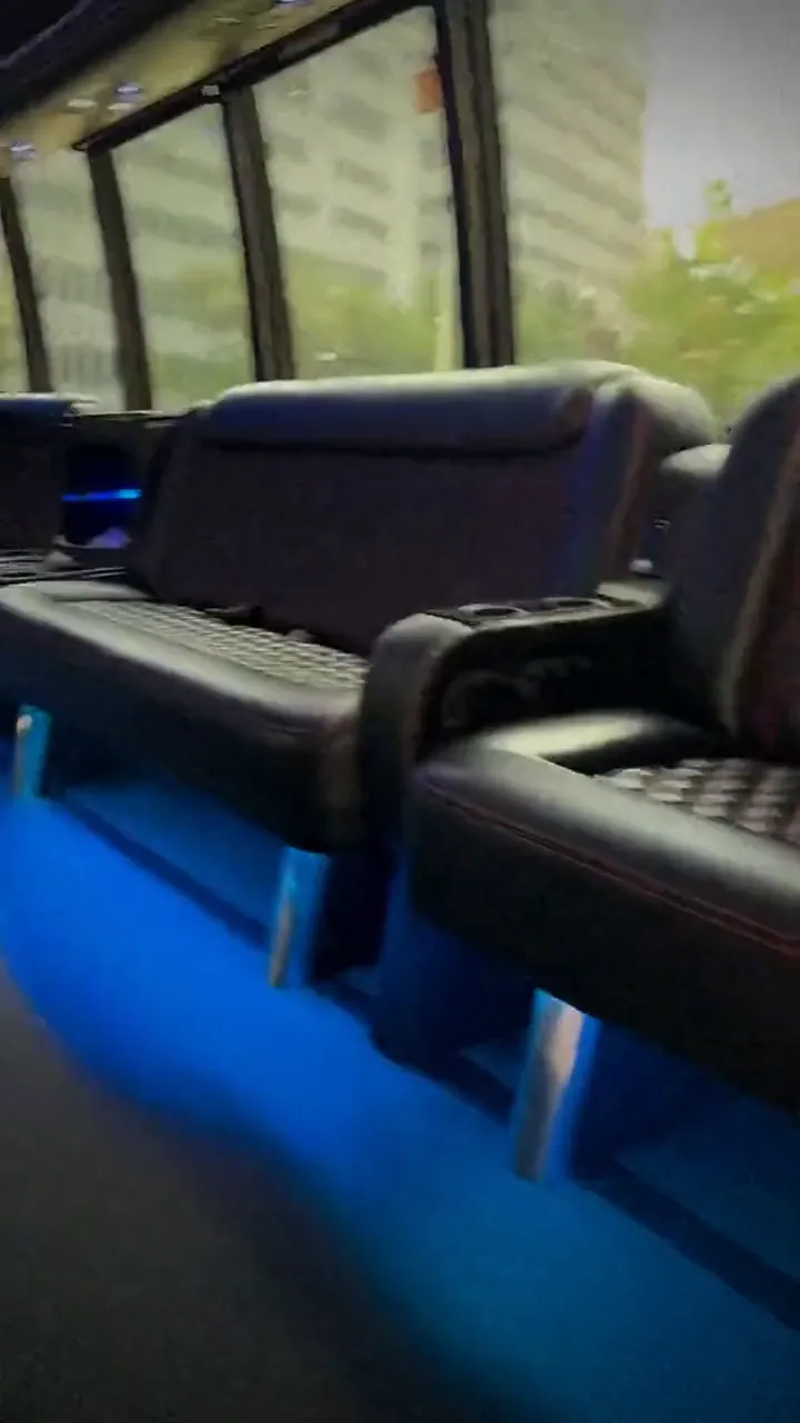 LED-lit leather lounge inside a TIED party bus